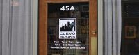 Clevo Books Door Clevo Books door at the front of their store with their logo and open hours